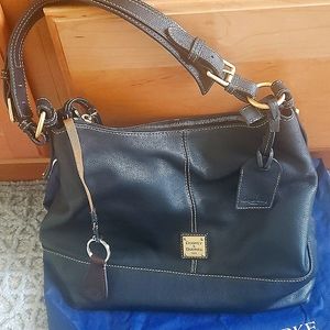 Dooney and Bourke Italian leather black handbag. Spacious inside like new.